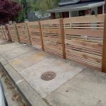 Decorative wooden fence installed by Emperor Fence LLC