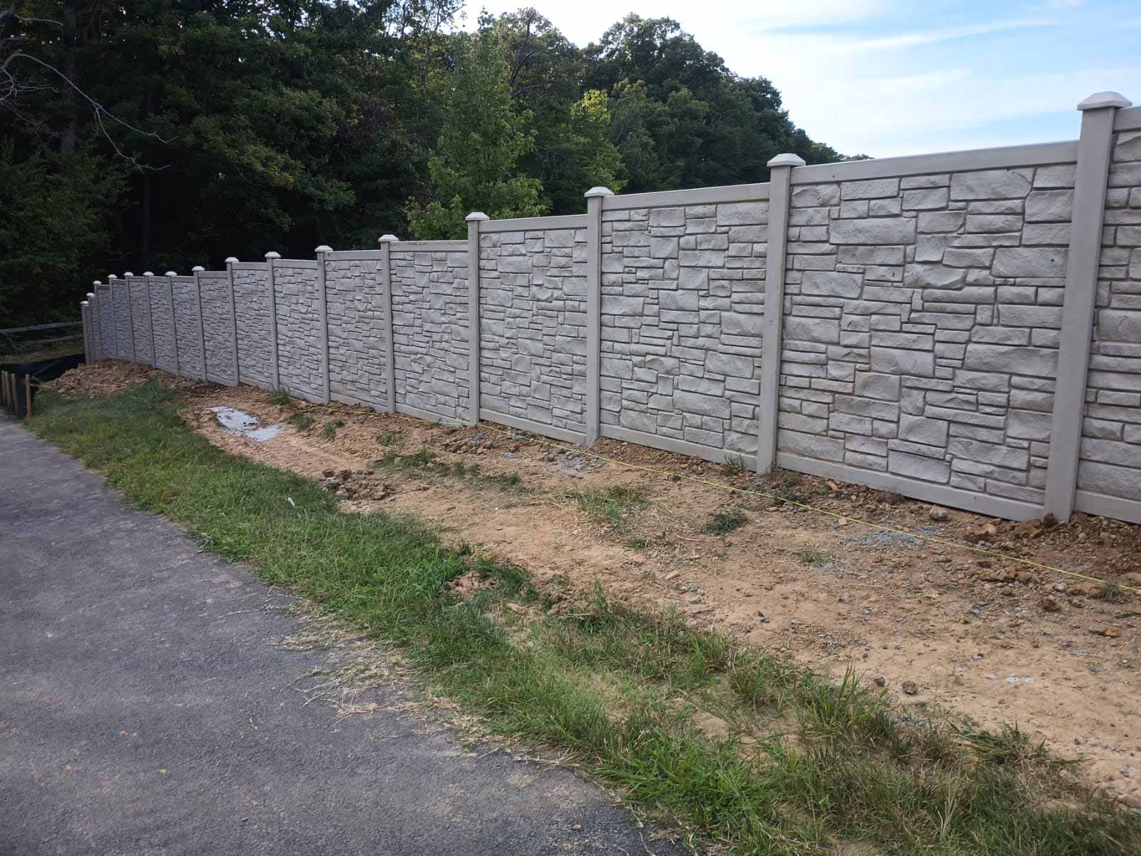 Decorative stone fence installed by Emperor Fence LLC