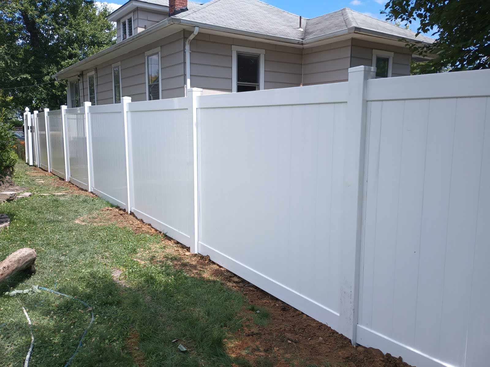 White vinyl privacy fence installed by Emperor Fence LLC