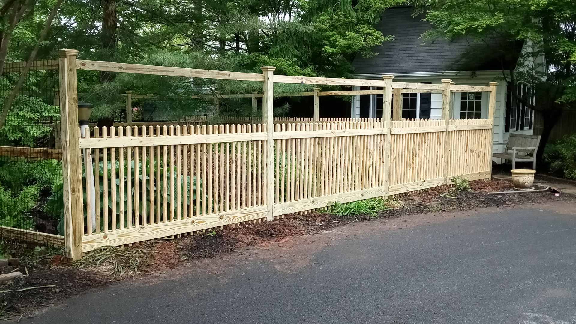 Wooden fence installed by Emperor Fence LLC