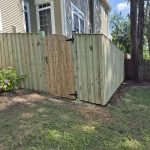 New wooden privacy fence and gate installed by Emperor Fence, LLC