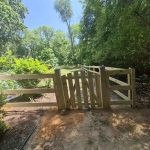 New wooden fence and gate installed by Emperor Fence, LLC